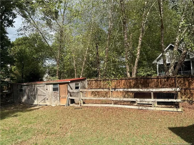 a backyard of a house with lots of green space