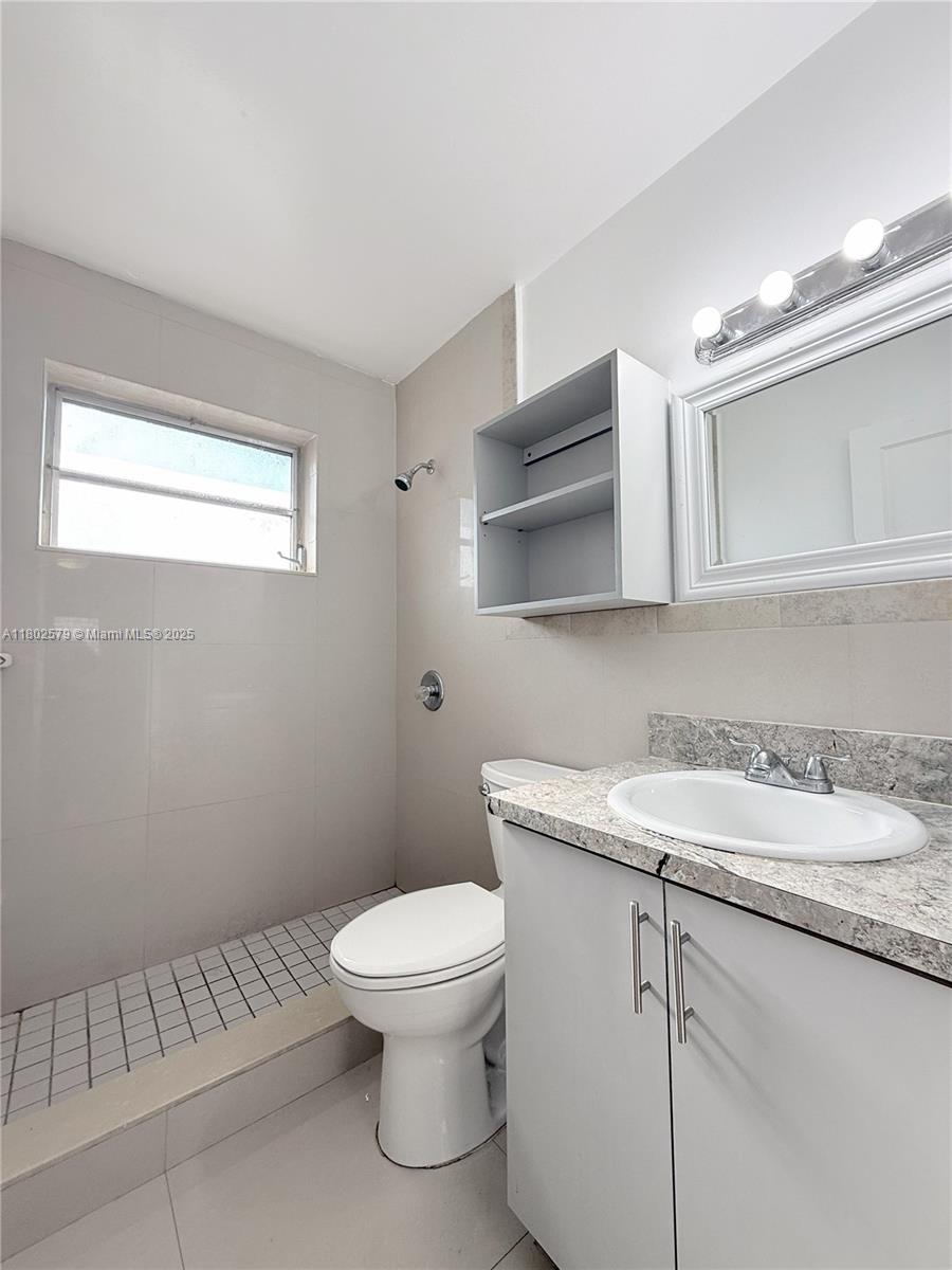 Flagami Miami, FL 33134 - Photo 10 of 10 a white toilet sitting next to a bathroom sink