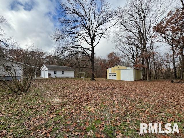 5267 Old North Road Christopher, IL 62822 - Photo 12 of 66 a front view of a house with a yard and garage