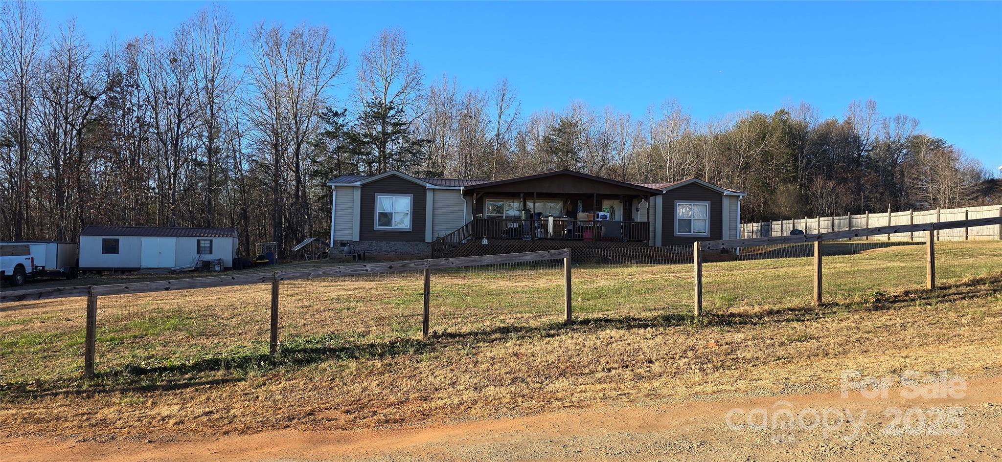 78 Buck Branch Rd Mill Spring Mill Spring, NC 28756 - Photo 1 of 1 a view of a house with a backyard
