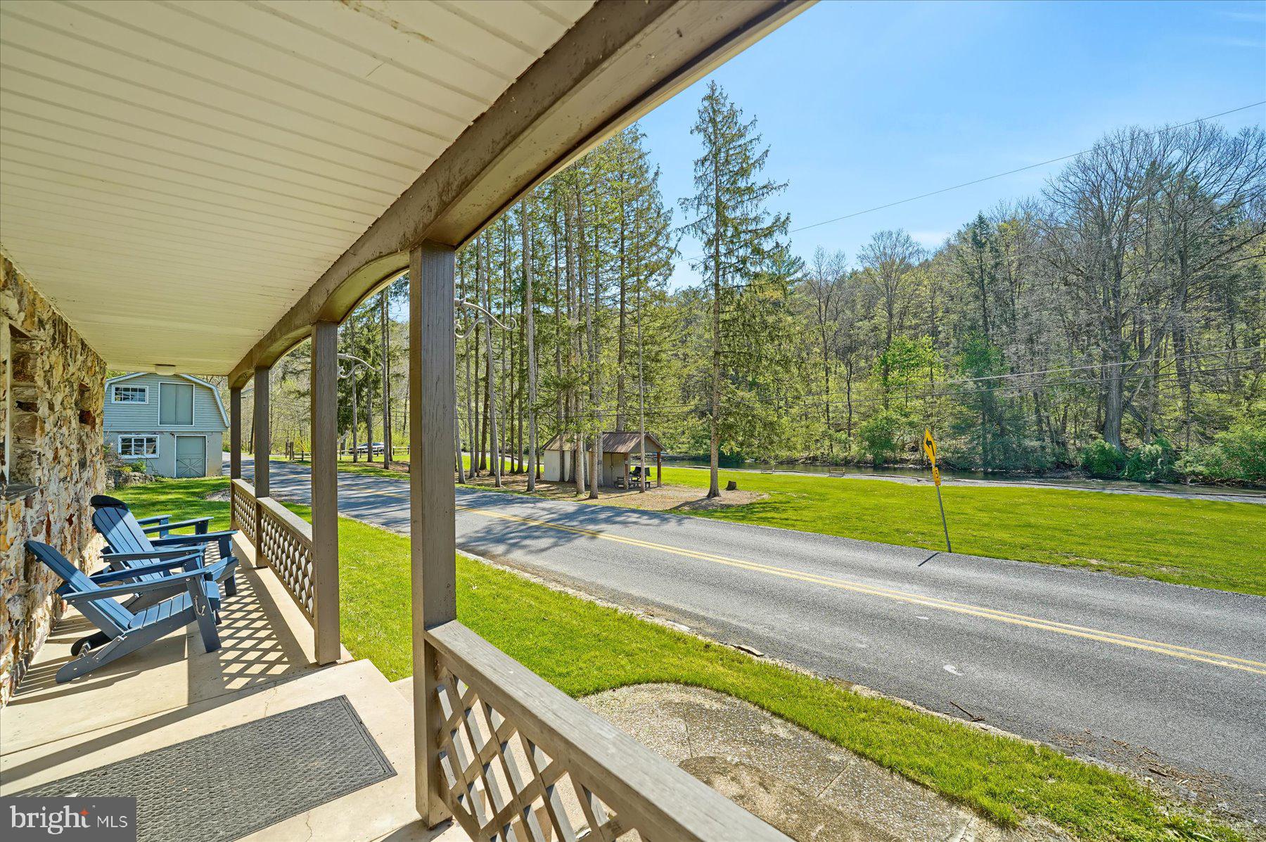 345 Spring Creek Road Bellefonte, PA 16823 - Photo 32 of 45 Charming porch with scenic views.