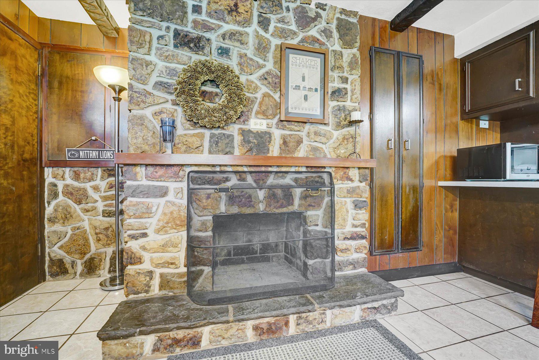 345 Spring Creek Road Bellefonte, PA 16823 - Photo 8 of 45 Rustic stone fireplace centerpiece.