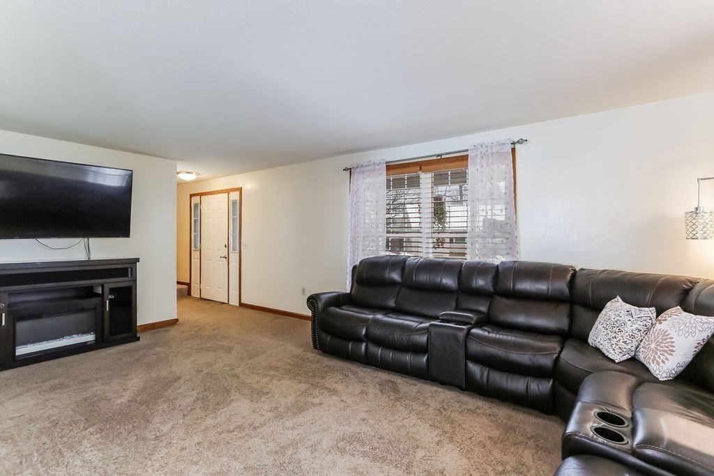 52 Eleanor Road Springfield, MA 01108 - Photo 5 of 34 a living room with furniture and a flat screen tv