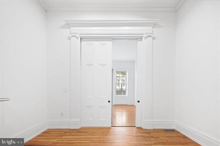 306 South 10th Street, Unit A Philadelphia, PA 19107 - Photo 14 of 36 a view of empty room with wooden floor and fan