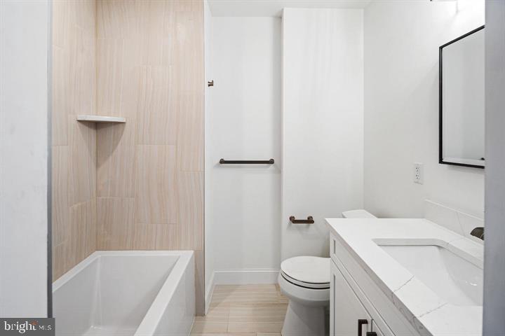 306 South 10th Street, Unit A Philadelphia, PA 19107 - Photo 22 of 36 a bathroom with a sink and toilet