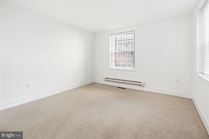 306 South 10th Street, Unit A Philadelphia, PA 19107 - Photo 24 of 36 an empty room with a window