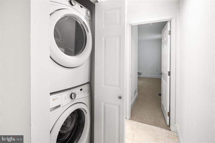 306 South 10th Street, Unit A Philadelphia, PA 19107 - Photo 26 of 36 a view of a hallway with washer and dryer