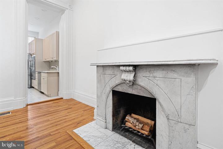 306 South 10th Street, Unit A Philadelphia, PA 19107 - Photo 4 of 36 a room with a fireplace and a rug