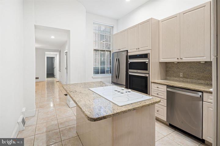 306 South 10th Street, Unit A Philadelphia, PA 19107 - Photo 7 of 36 a kitchen that has a sink a stove and oven