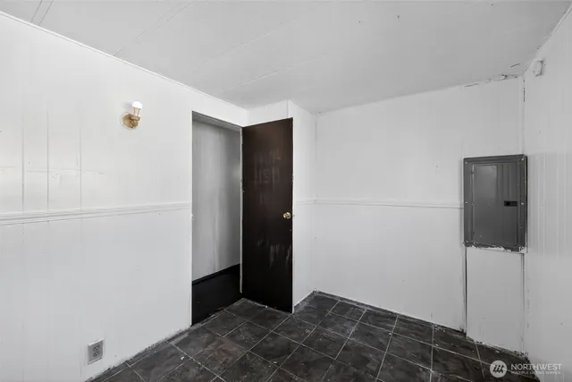 a kitchen with stainless steel appliances granite countertop a refrigerator a sink dishwasher a stove and white countertops with wooden floor