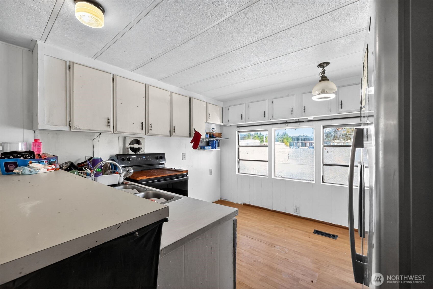 66 Fairgrounds Road, Unit 21 Elma, WA 98541 - Photo 20 of 31 a kitchen with a sink a stove and cabinets
