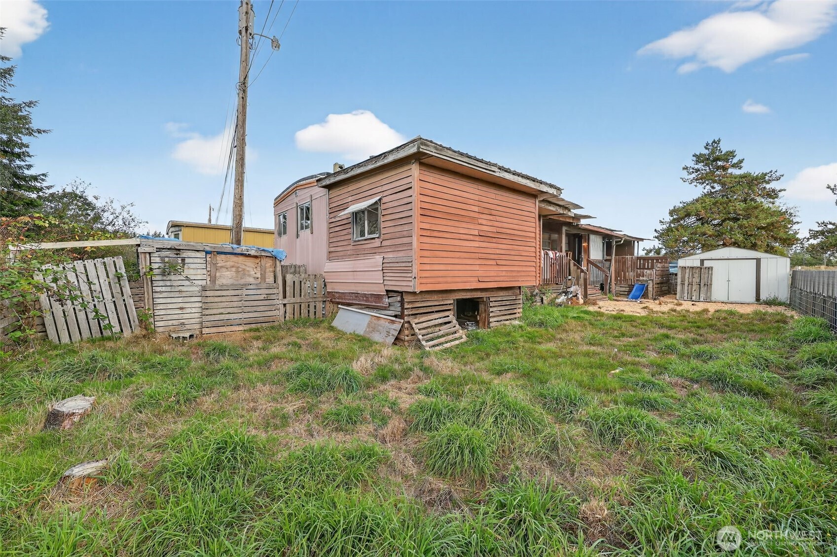 66 Fairgrounds Road, Unit 21 Elma, WA 98541 - Photo 30 of 31 a house view with a garden space