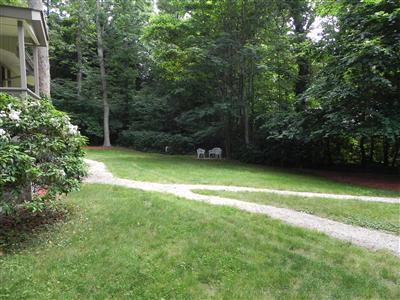 16 F R Lillie Road Woods Hole, MA 02543 - Photo 11 of 19 a view of a green yard