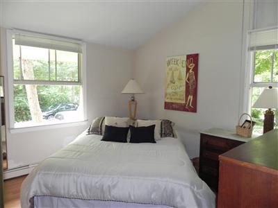 16 F R Lillie Road Woods Hole, MA 02543 - Photo 8 of 19 a bedroom with a bed and a window