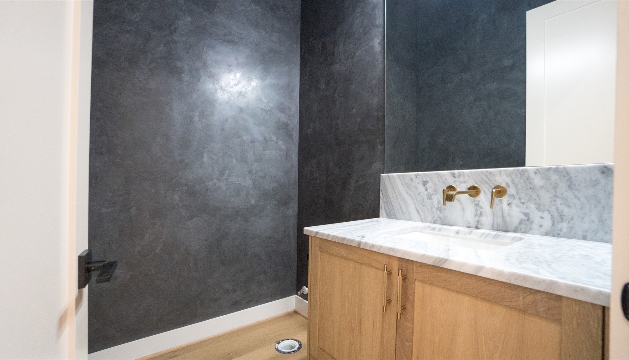 9345 Leto Road Houston, TX 77080 - Photo 13 of 22 a white bath tub sitting next to a white cabinet