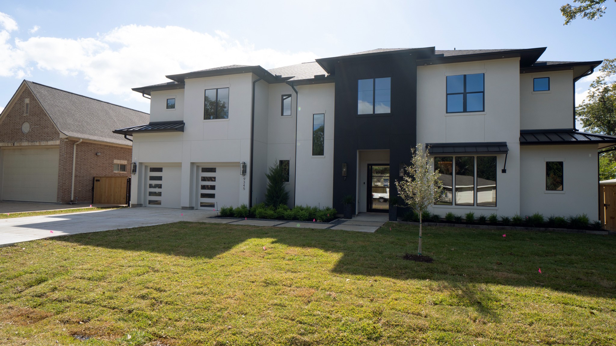 9345 Leto Road Houston, TX 77080 - Photo 19 of 22 a view of a brick house with a yard