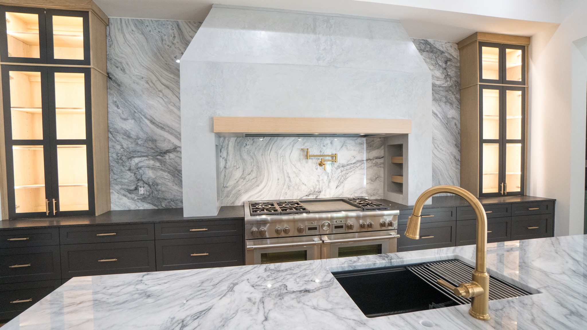 9345 Leto Road Houston, TX 77080 - Photo 2 of 22 a kitchen with a stove a sink and a window