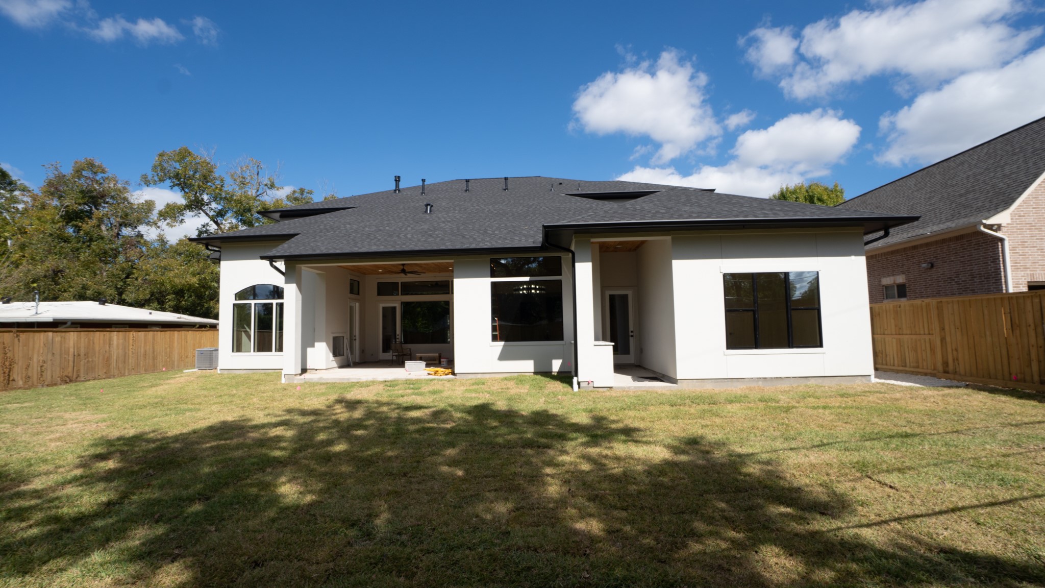 9345 Leto Road Houston, TX 77080 - Photo 21 of 22 a view of a house with a yard