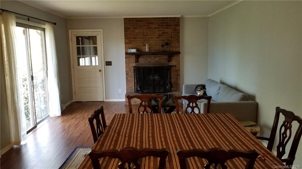 7045 Ridge Lane Road Charlotte, NC 28262 - Photo 11 of 19 a view of a dining room with furniture and wooden floor