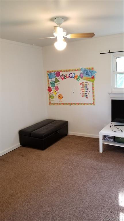 7045 Ridge Lane Road Charlotte, NC 28262 - Photo 15 of 19 a room with furniture and a window