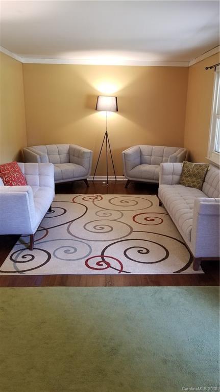 7045 Ridge Lane Road Charlotte, NC 28262 - Photo 7 of 19 a living room with furniture and a couch