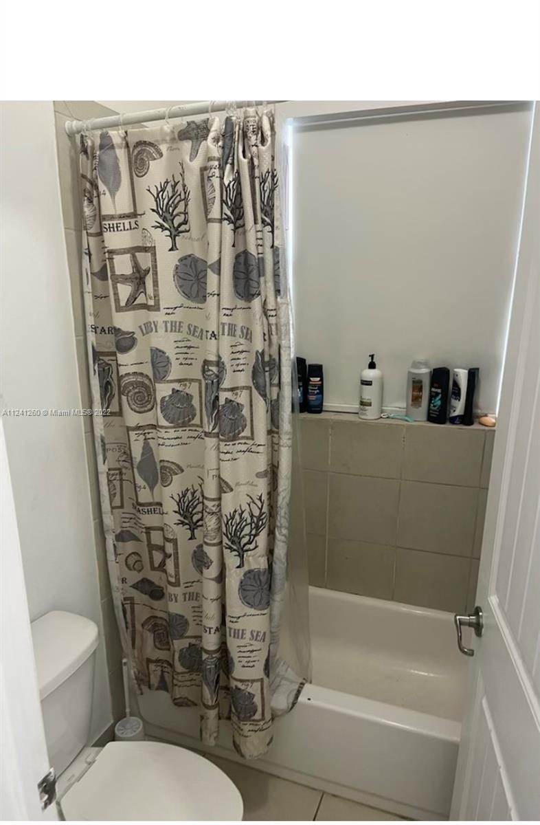 28281 Southwest 128th Place Homestead, FL 33033 - Photo 19 of 39 a bathroom with a toilet and shower