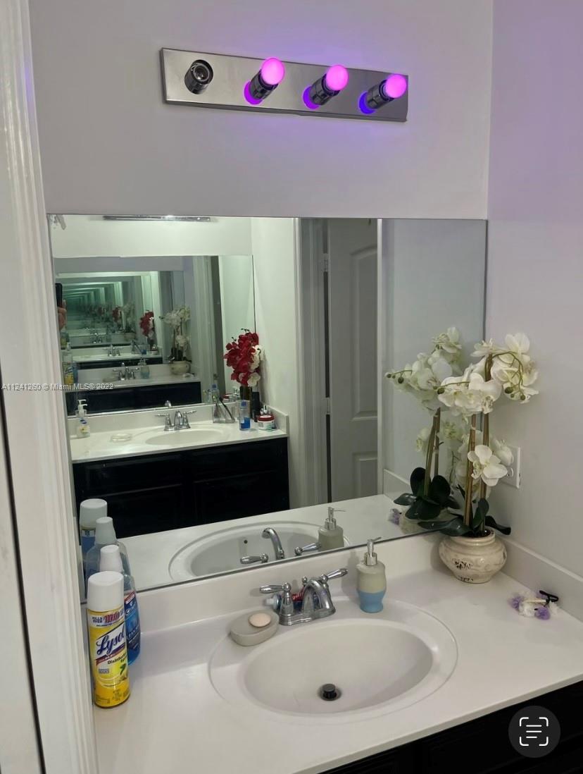 28281 Southwest 128th Place Homestead, FL 33033 - Photo 21 of 39 a bathroom with a sink and a mirror