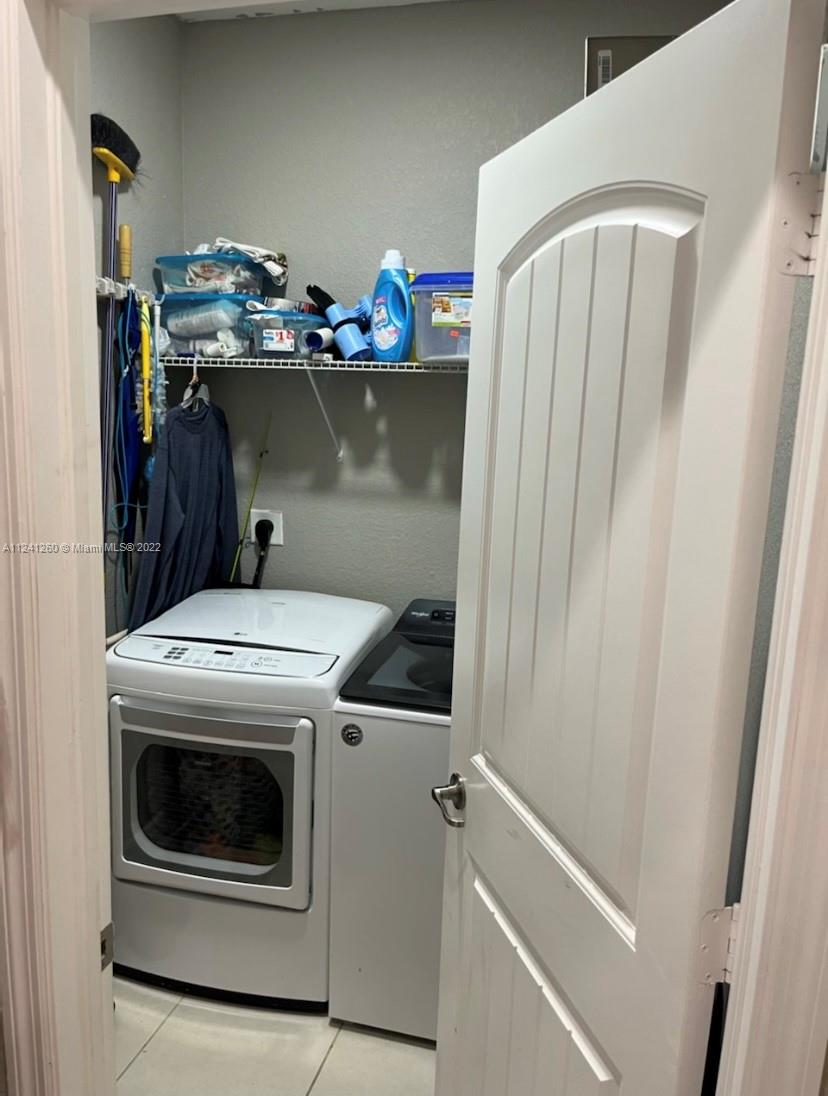28281 Southwest 128th Place Homestead, FL 33033 - Photo 26 of 39 a utility room with dryer and washer