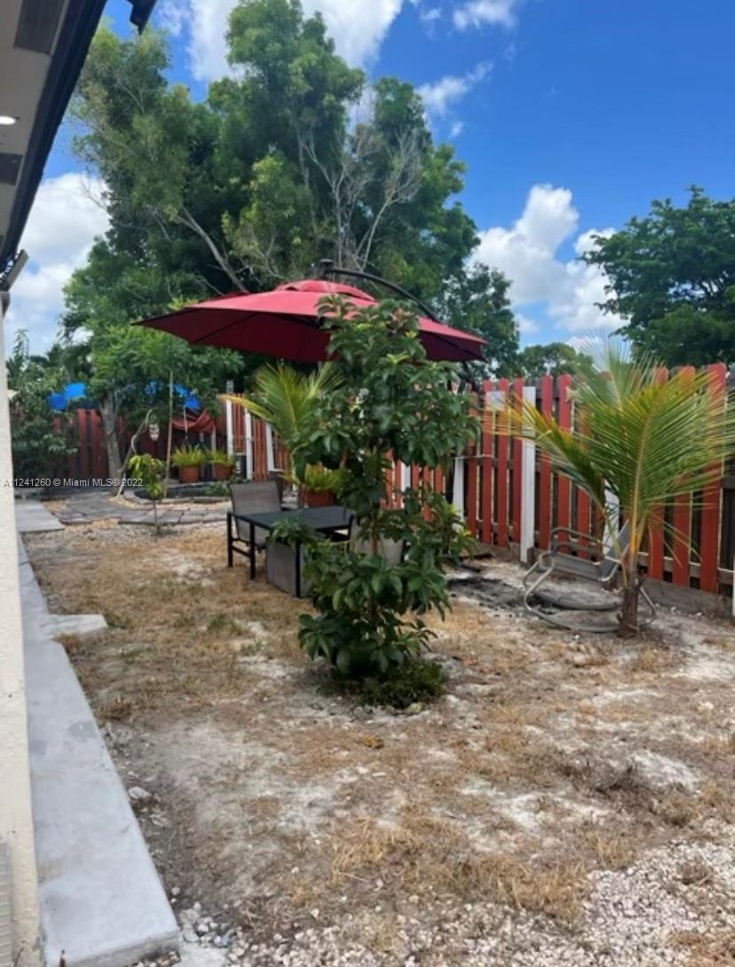 28281 Southwest 128th Place Homestead, FL 33033 - Photo 27 of 39 a view of a house with a yard and sitting area