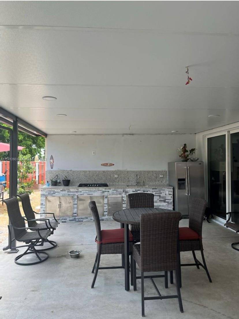 28281 Southwest 128th Place Homestead, FL 33033 - Photo 35 of 39 a view of a dining room with furniture window and outside view