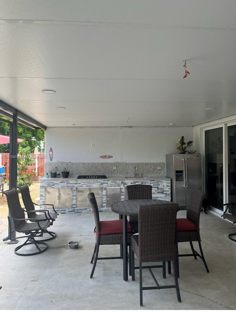 28281 Southwest 128th Place Homestead, FL 33033 - Photo 37 of 39 a view of a dining room with furniture