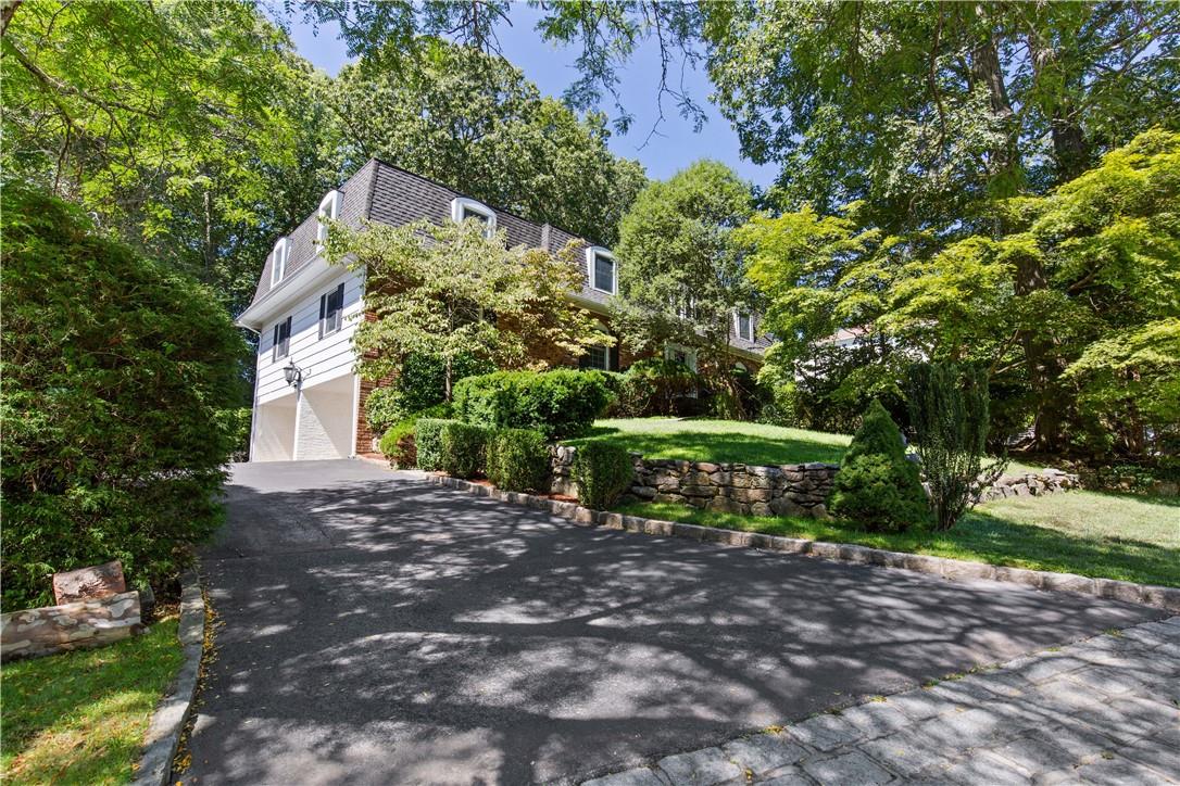 33 Springdale Road Scarsdale, NY 10583 - Photo 1 of 1 a front view of a house with a yard