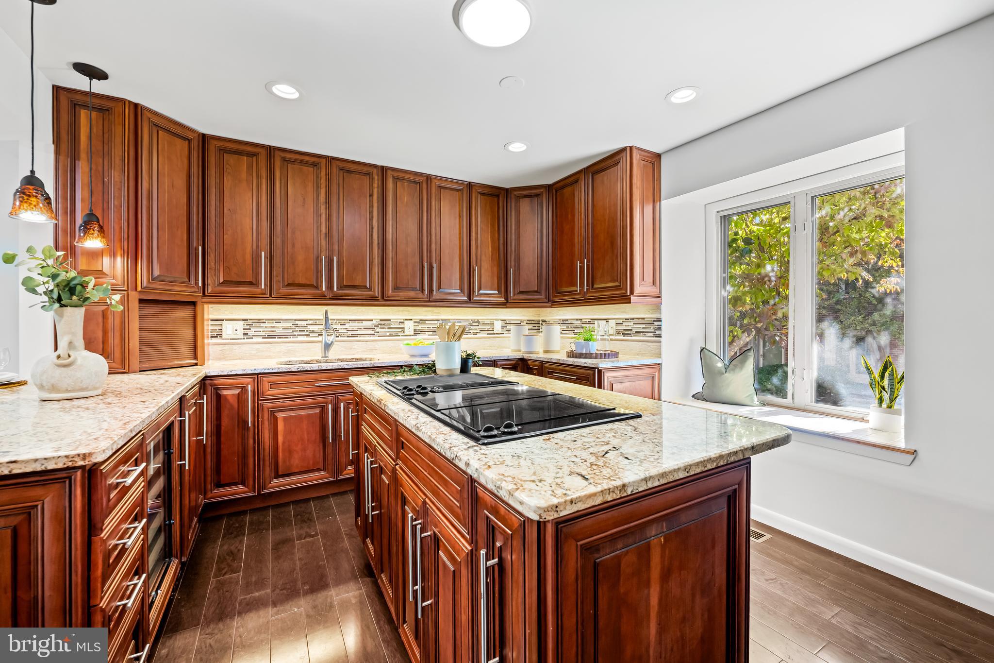 254 Waxter Way Baltimore, MD 21217 - Photo 11 of 44 a kitchen with granite countertop a sink a counter space and cabinets