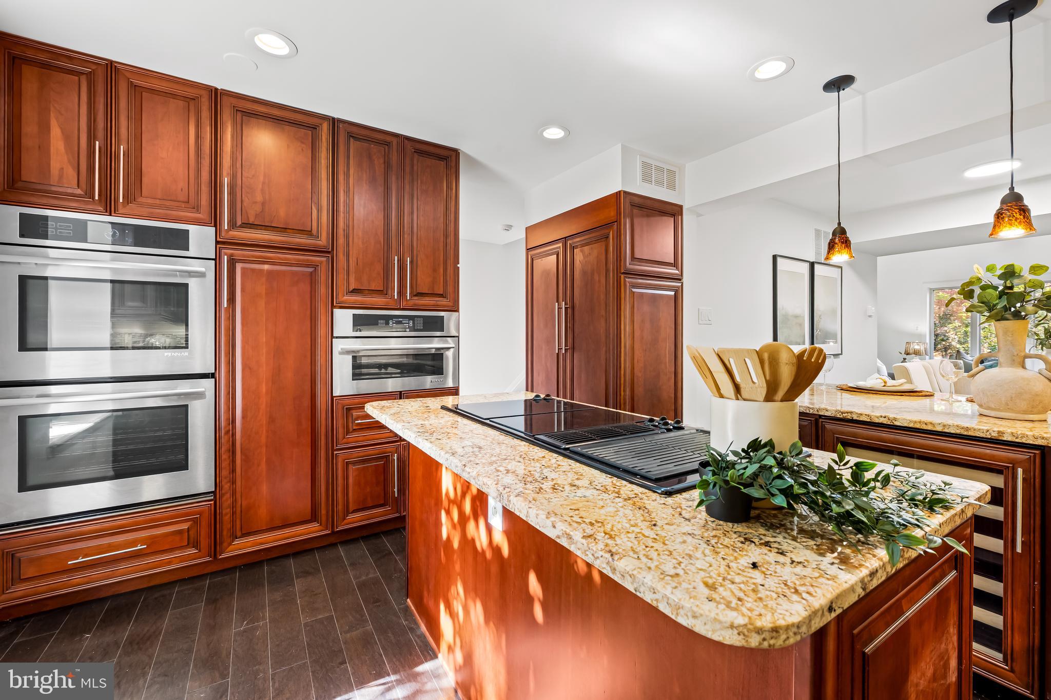 254 Waxter Way Baltimore, MD 21217 - Photo 16 of 44 a kitchen with stainless steel appliances granite countertop a stove and a wooden cabinets
