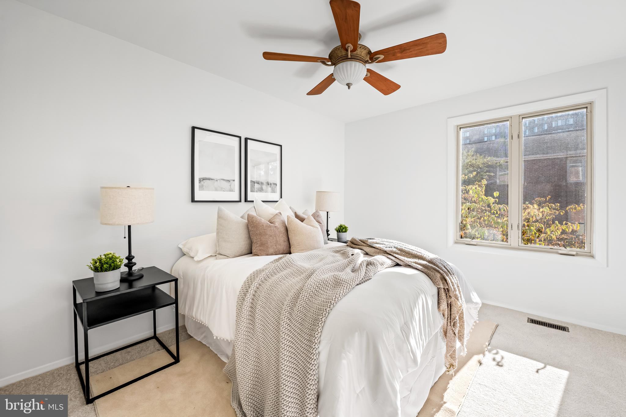 254 Waxter Way Baltimore, MD 21217 - Photo 21 of 44 a bedroom with a bed chandelier and a window