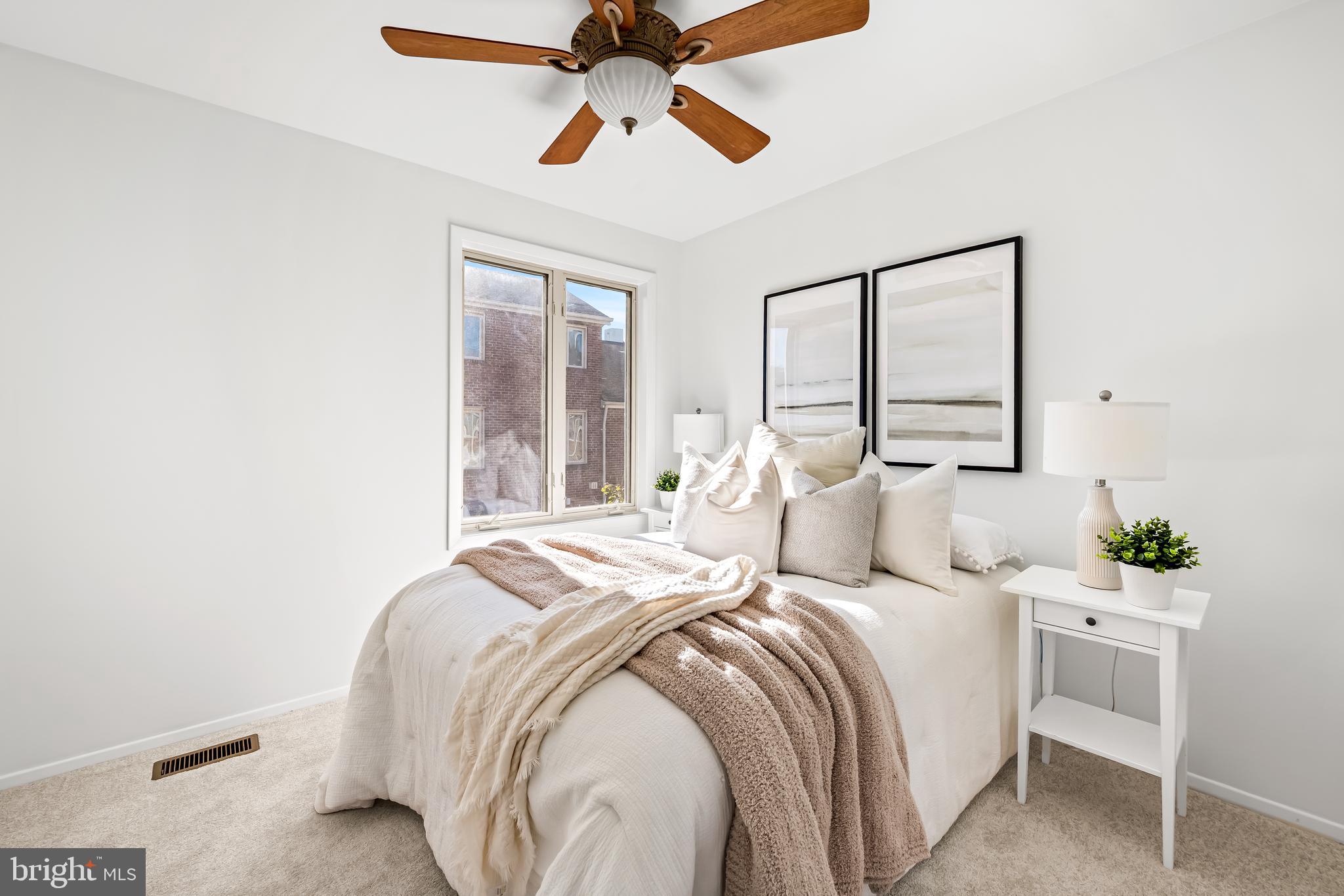 254 Waxter Way Baltimore, MD 21217 - Photo 23 of 44 a bedroom with a large bed and a chandelier