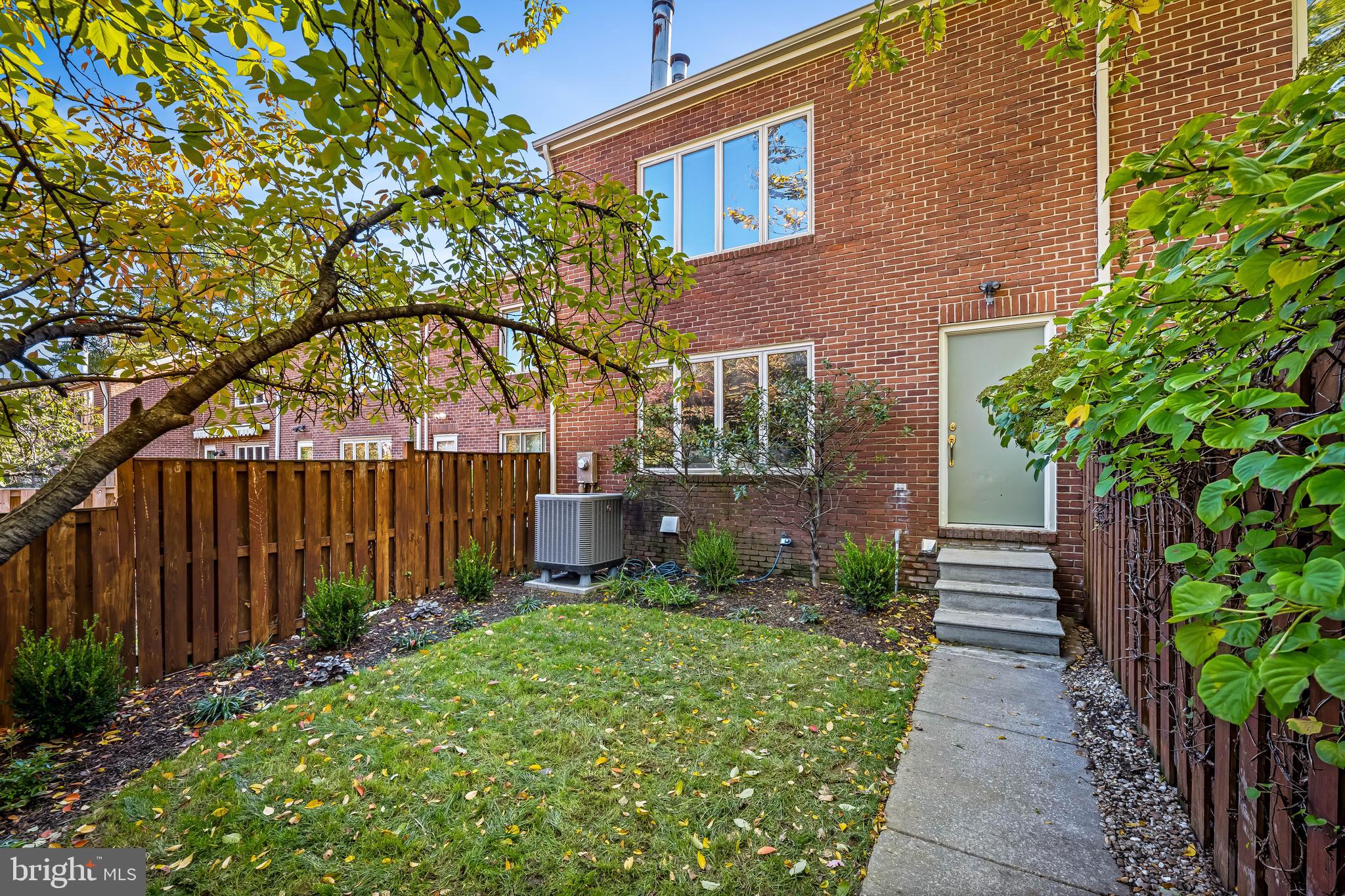 254 Waxter Way Baltimore, MD 21217 - Photo 37 of 44 a front view of a house with garden