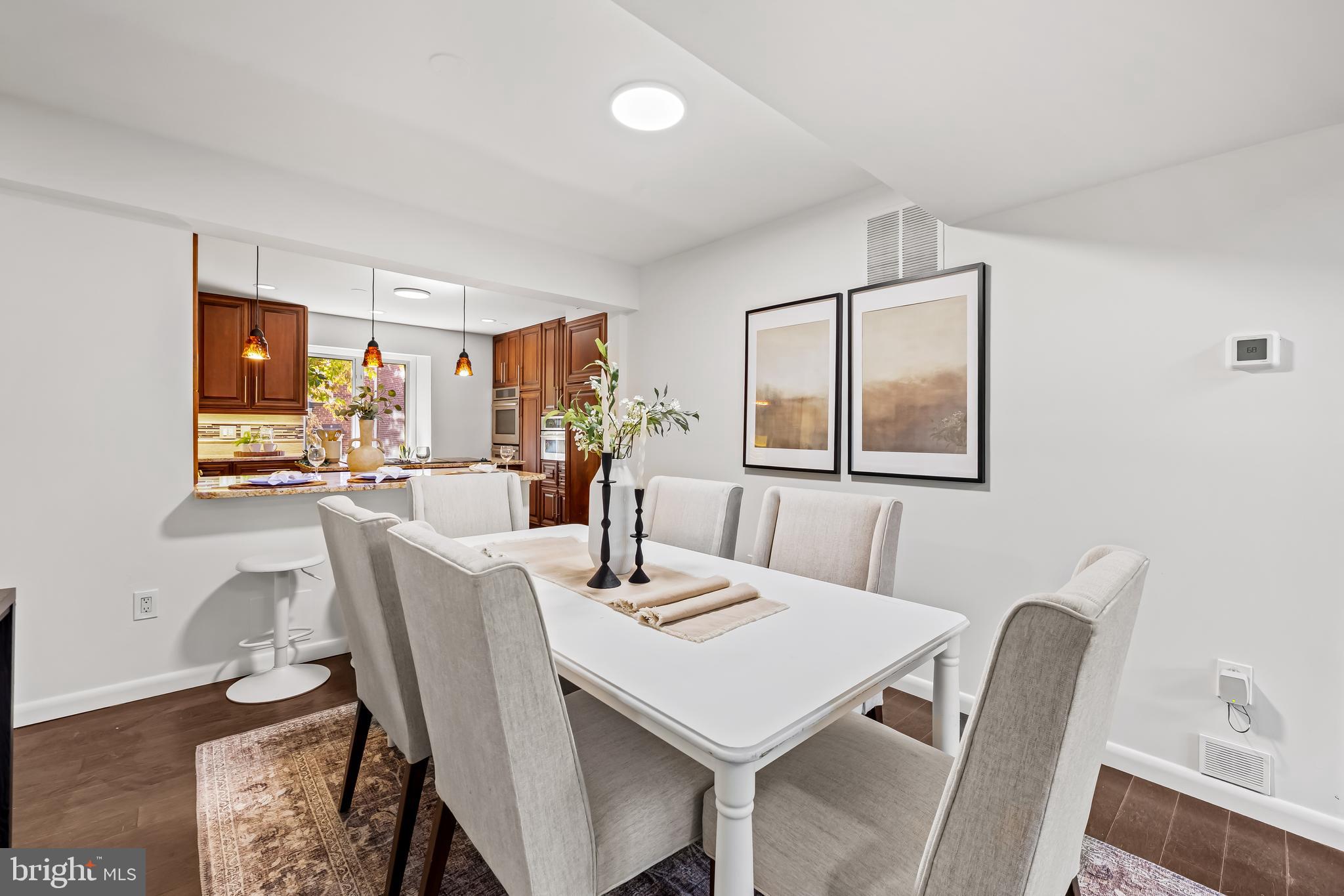 254 Waxter Way Baltimore, MD 21217 - Photo 8 of 44 a view of a dining room with furniture and a potted plant