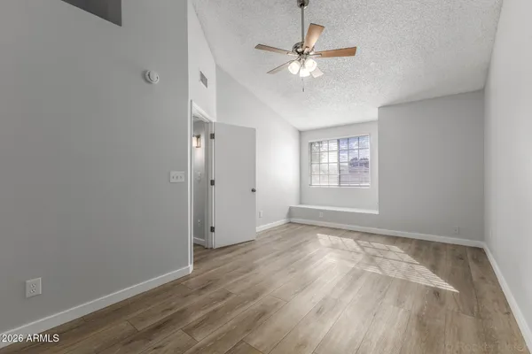 a view of an empty room with a window