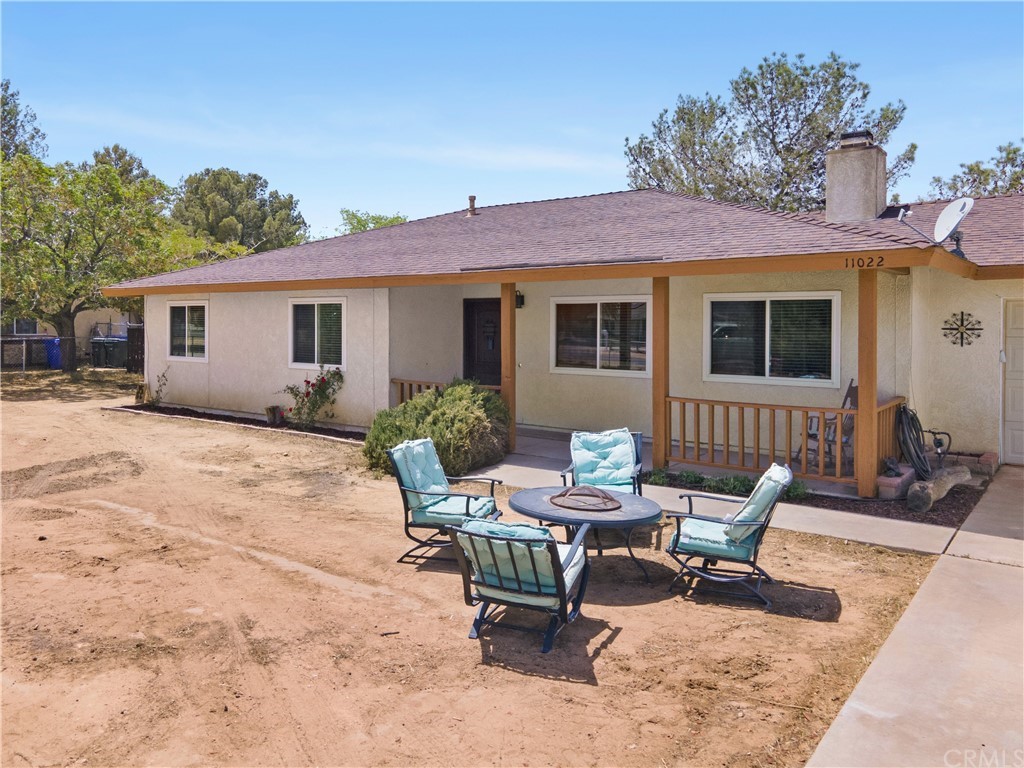 11022 Lancelet Road Apple Valley, CA 92308 - Photo 1 of 1 a view of a house with yard and sitting area