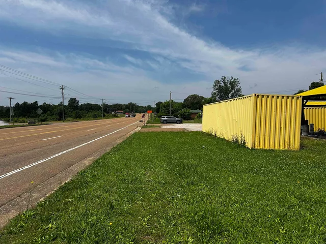 a view of yard with swimming pool and table and chairs