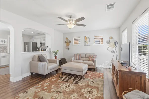 a living room with furniture and a window
