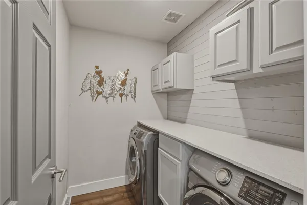 a view of storage and utility room with washer and dryer