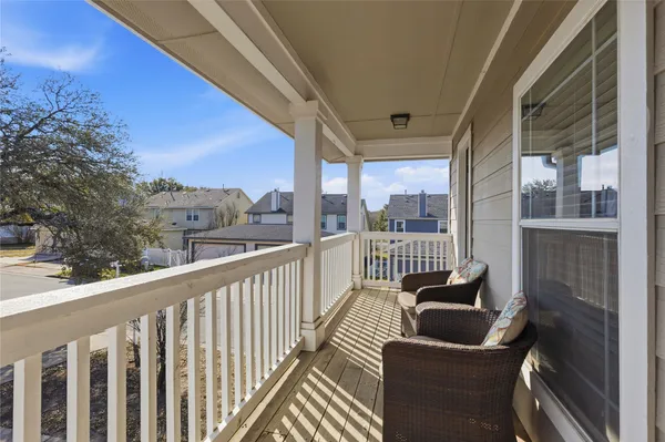 a view of balcony with couches