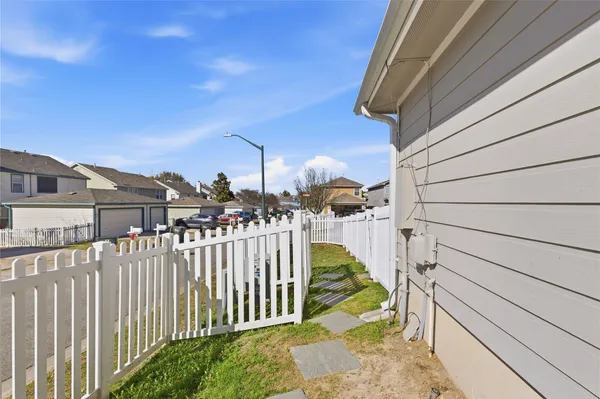 a view of a house with a small yard
