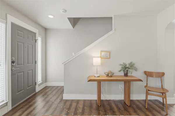 a view of a hallway with seating area