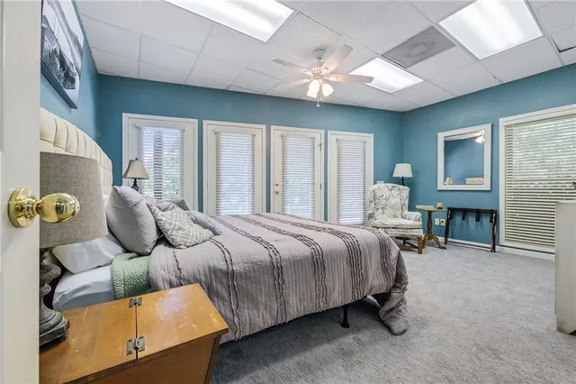 a bedroom with furniture and a fireplace