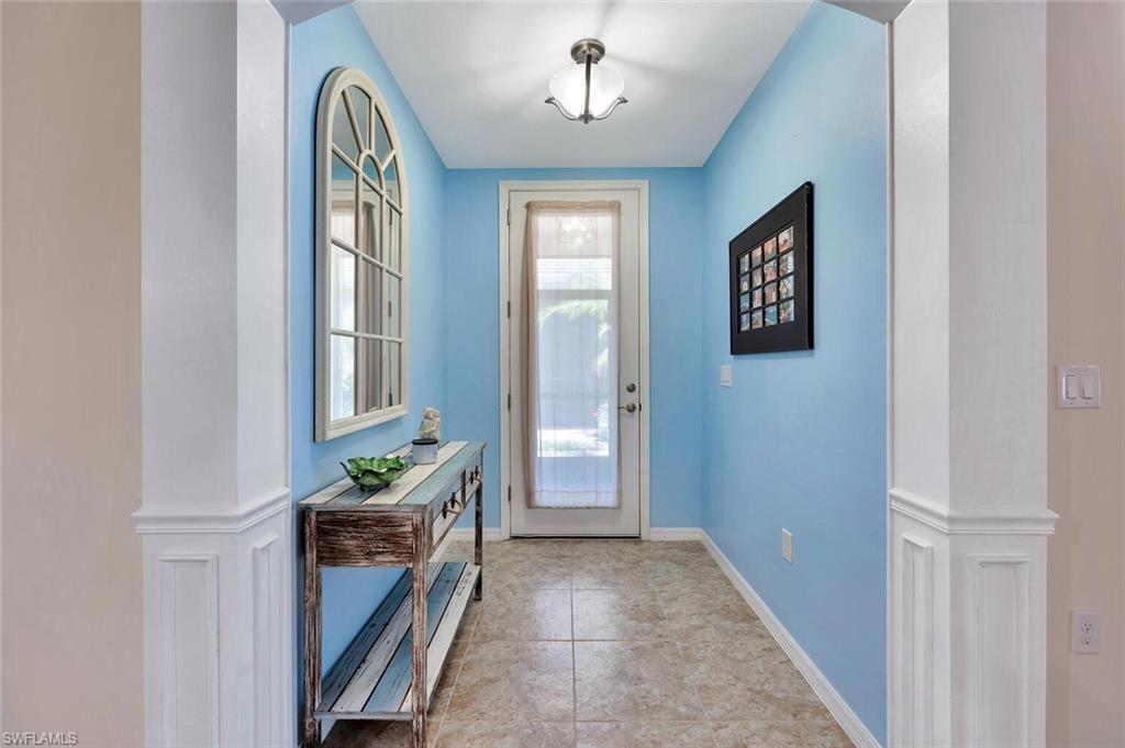 14940 Edgewater Circle Naples, FL 34114 - Photo 13 of 39 a view of livingroom with furniture and windows