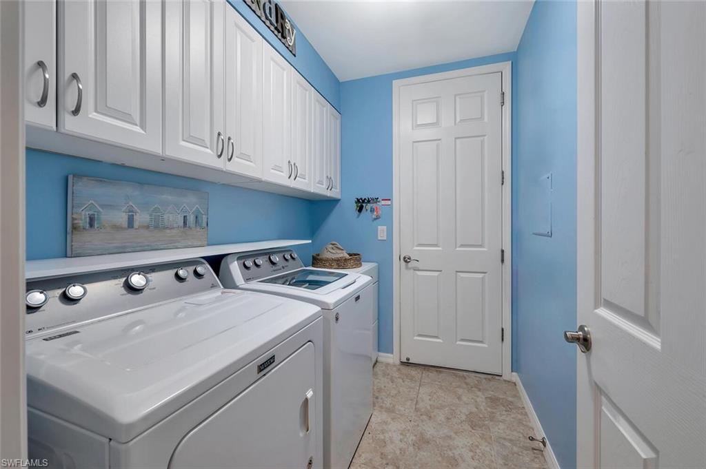 14940 Edgewater Circle Naples, FL 34114 - Photo 26 of 39 a utility room with dryer and washer