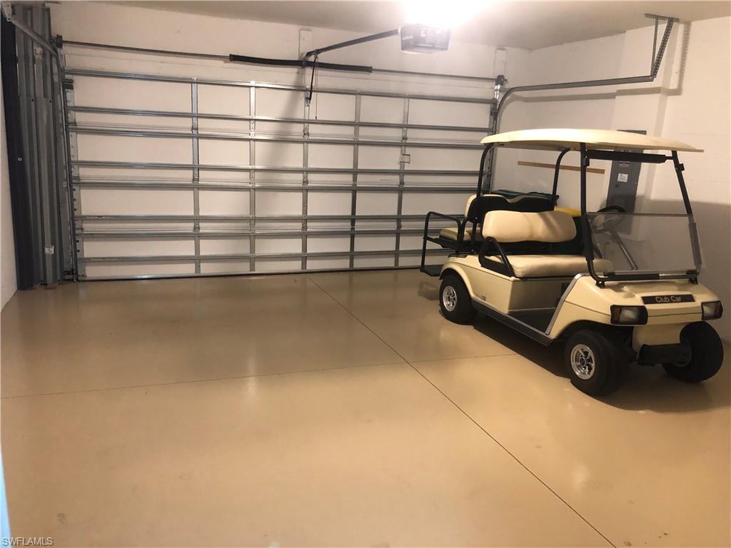 14940 Edgewater Circle Naples, FL 34114 - Photo 27 of 39 a view of a room with gym equipment